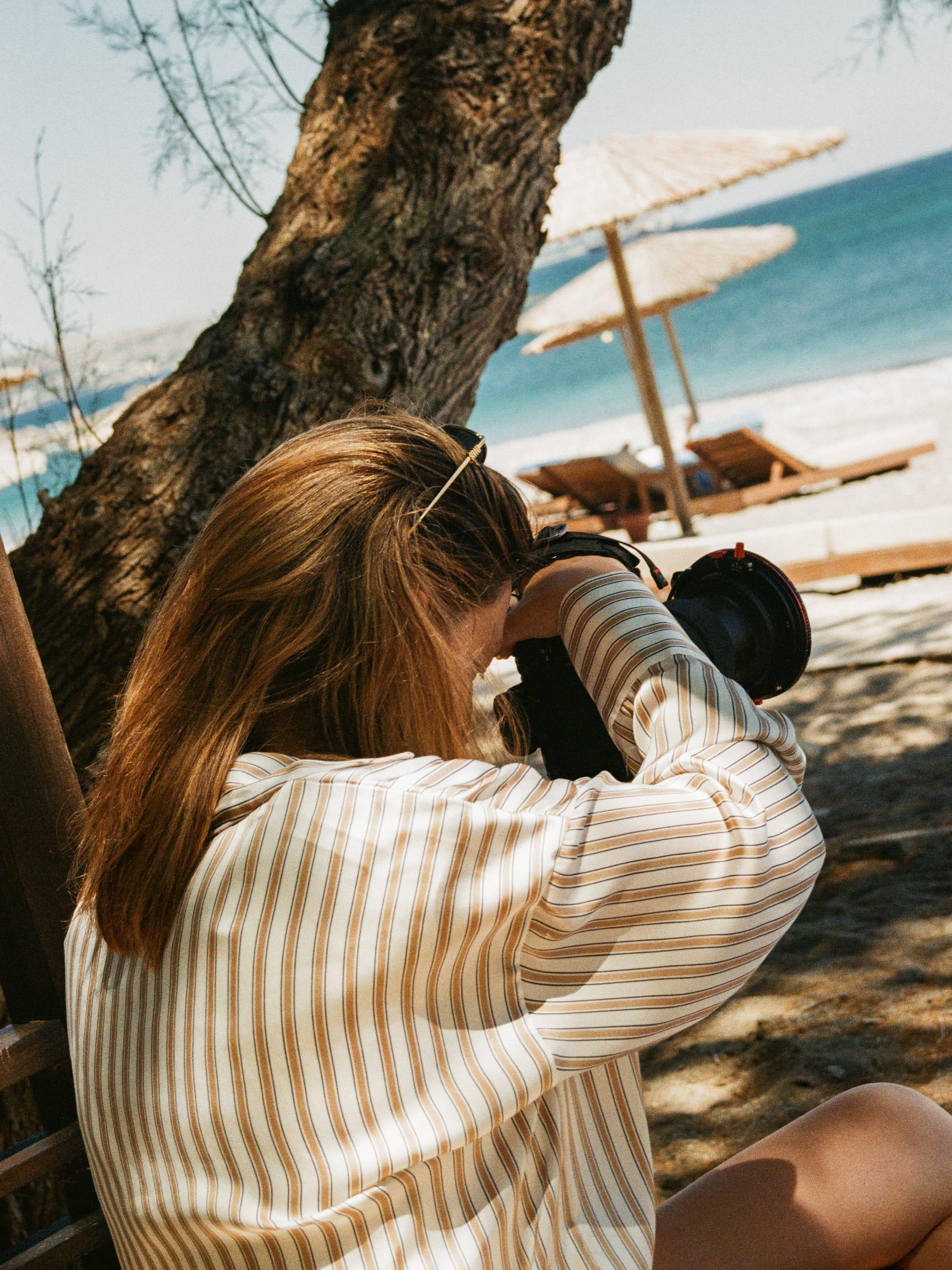 Shooting out from under the tree toward the loungers and the water